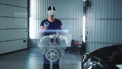 Car service manager uses virtual reality with futuristic augmented reality diagnostic software with holographic 3D engine visualisation.