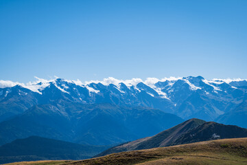 snow capped mountain range in Mestia, Svaneti region in Georgia. Landscape of mountain with snow in Caucasus. Snowy mountain landscape with copy space