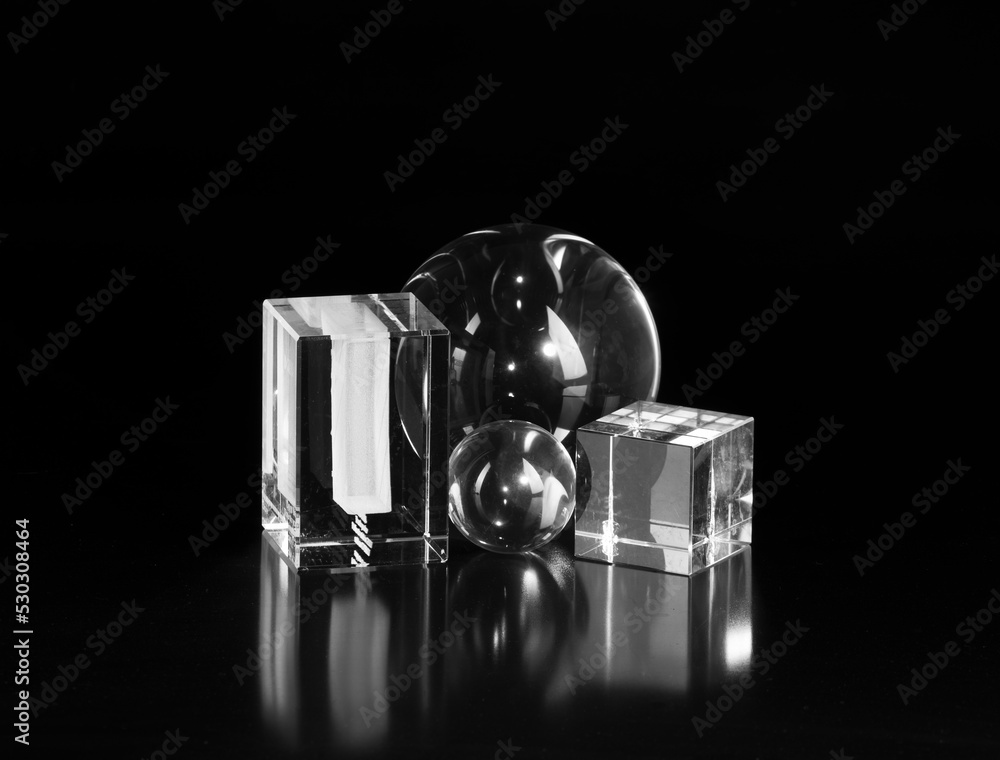 Poster glass cubes and balls isolated on black background