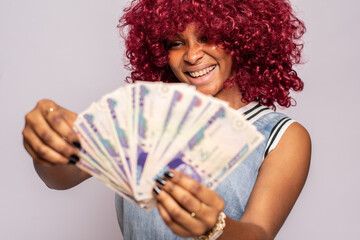 excited and happy african lady flaunting some cash