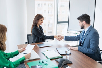 Business people shaking hands during meeting at the office