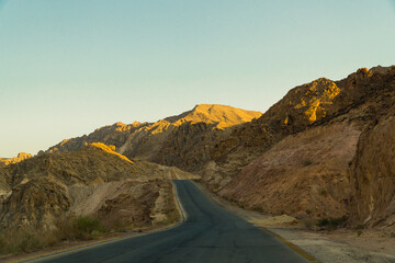road surrounded by the rocky mountains in Jordan. High quality photo