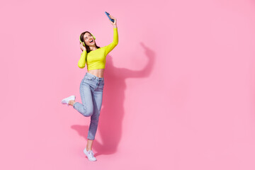 Full size photo of happy joyful lady dancer use gadget make blog video talk record dance fun empty...