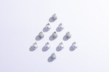 Image of christmas decoration white baubles forming christmas tree copy space on white background