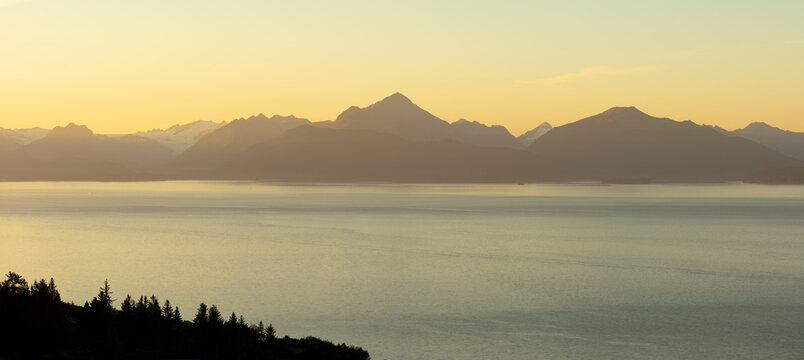 Panorama image of landscape with a fjord in Alaska at sunrise