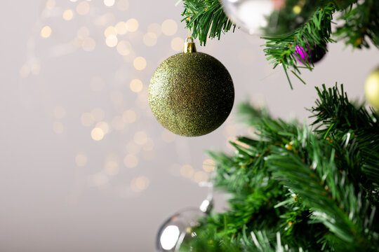 Image of christmas tree with baubles decoration on grey background