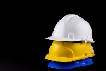 Image of stack of helmets lying on black surface