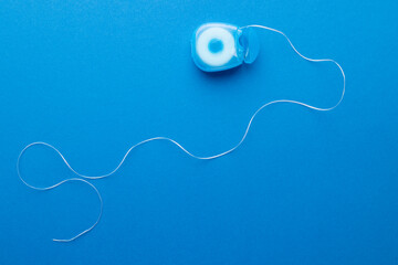 Image of dental string on blue surface
