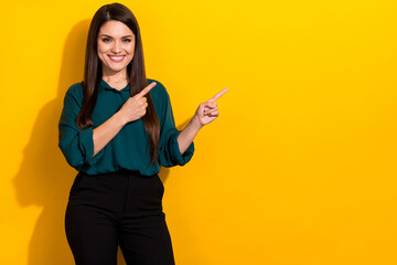 Photo of young lady indicate fingers empty space promotion select direct banner isolated over...