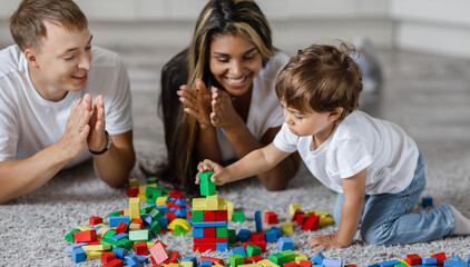 Parents watch the game and the development of their child