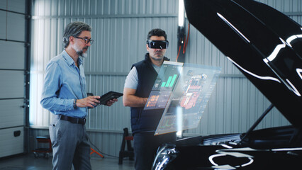 Two specialists carry out car diagnostics using modern tools. They study the indicators and graphs...