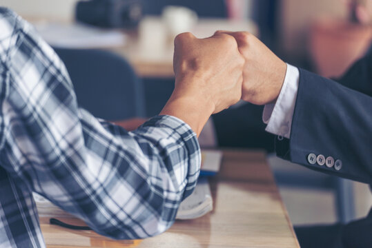 Two Men team fist bump Business Partner Businessman Trust Teamwork Partnership Industry contractor dealing mission business. Mission Business team meeting group of People Fist bump Hands together