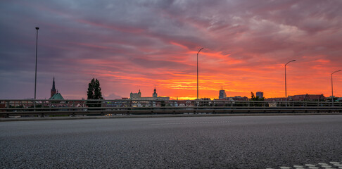 Entrance road to the city during the beautiful, bloody sunset