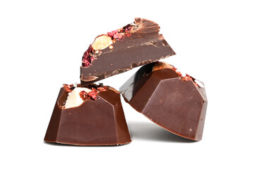 Cut luxury handmade bonbon with berry and nuts filling isolated on white background. Exclusive handcrafted candies