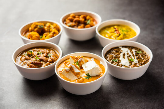Group of Indian vegetarian dishes, hot and spicy Punjabi cuisine meal assortment in bowls