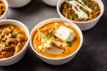 Group of Indian vegetarian dishes, hot and spicy Punjabi cuisine meal assortment in bowls