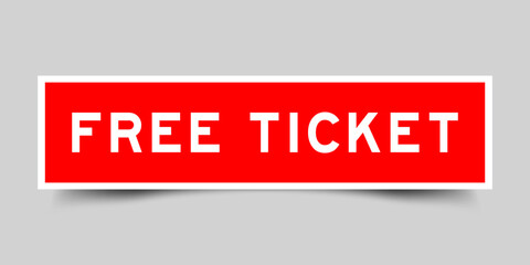 Sticker label with word free ticket in red color on gray background