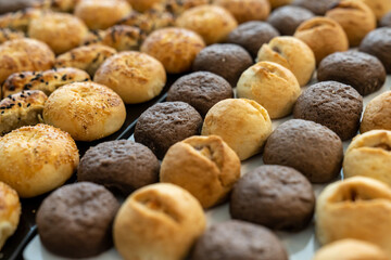 coffee break hotel during conference meeting, corporate revent with tea and coffee catering, decorated catering banquet table with variety of different pastry and bakery, with croissants and cookies