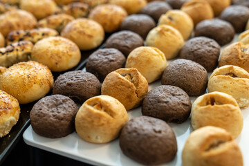 coffee break hotel during conference meeting, corporate revent with tea and coffee catering, decorated catering banquet table with variety of different pastry and bakery, with croissants and cookies