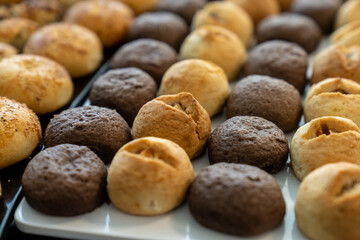 coffee break hotel during conference meeting, corporate revent with tea and coffee catering, decorated catering banquet table with variety of different pastry and bakery, with croissants and cookies