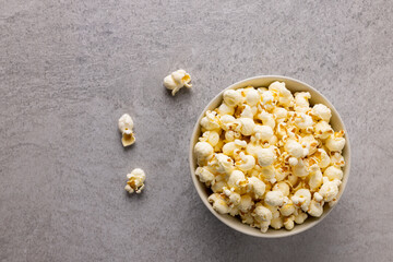 Image of pop corn in bowl on grey surface