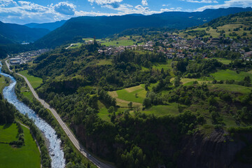 Fototapeta na wymiar aerial view of the town of cavalese with the avisio river in trentino