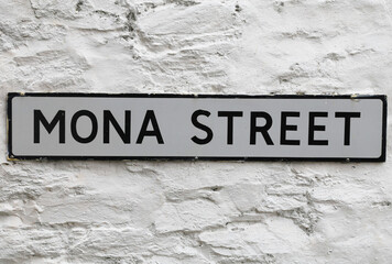 Ramsey, Isle of Man. July 10, 2022. A close up view of a sign for Mona Street.