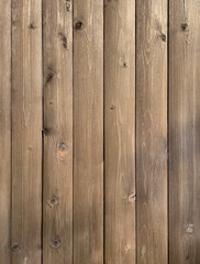 Fototapeta premium Vertical wooden planks with knots. Wooden background.