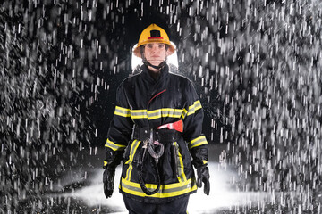 Portrait of a female firefighter standing and walking brave and optimistic.