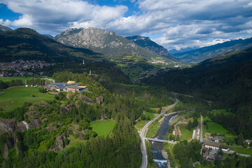 Fototapeta na wymiar aerial view of the town of cavalese with the avisio river and pale di san martino trentino