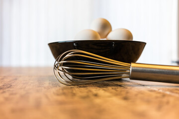 fresh white organic eggs with whisk for omelette