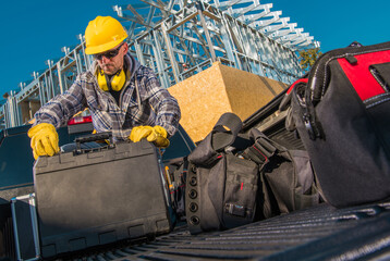 Contractor Packing Up His Tools After Finished Work © Tomasz Zajda