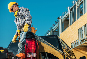 Construction Worker Taking Tools Out of Trunk