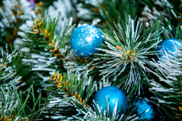 Christmas blue decoration close-up on spruce branches. Christmas and New Year holidays background.