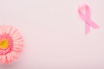 Pink Breast Cancer Awareness Ribbon. Gerbera and pink ribbon on backgrounds. Breast cancer...