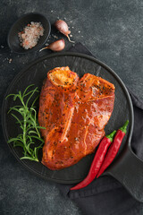 Raw steak t-bone or porterhouse. Steak t-bone or porterhouse in sauce with spices, salt and...