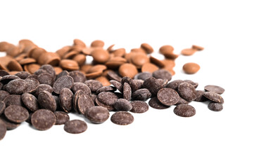 Close up of dark and milk couverture chocolate. Chocolate callets isolated on white. Chocolate...