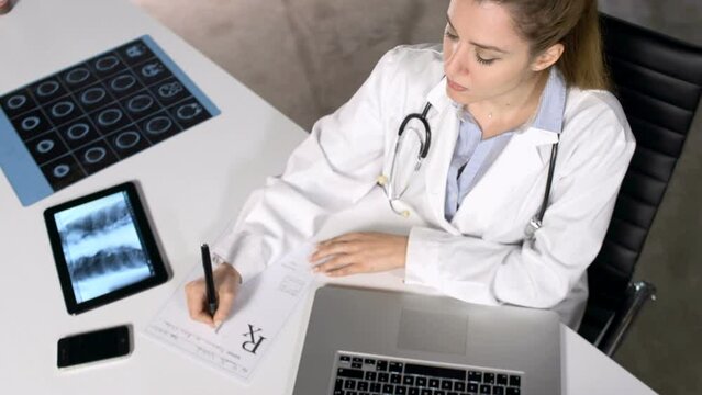 doctor working on computer in office