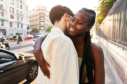 Boyfriend Hugging Black Girlfriend On Street