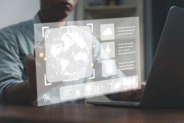 Businessman touching screen virtual icon eco energy sustainable environment digital technology concept.