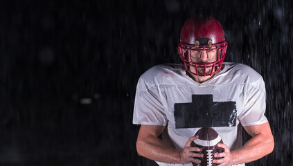 American Football Field: Lonely Athlete Warrior Standing on a Field Holds his Helmet and Ready to...