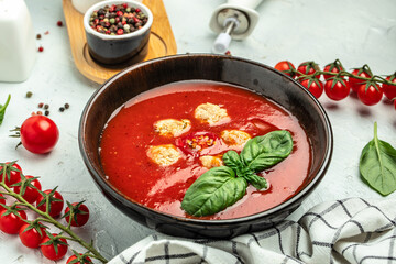 Spicy tomato soup with meatballs and vegetables on a dark background, Restaurant menu, dieting, cookbook recipe top view
