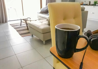 Pour drink black coffee in black mug cup breakfast Thailand.