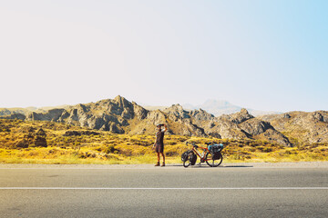Cinematic travel inspirational panorama caucasian traveler cyclist stand on road take smiley...
