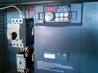 Frequency inverter, and circuit breaker in electrical cabinet of automation control system.