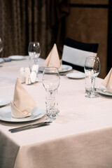 Banquet table with wineglasses. High angle of elegant banquet table served for wedding celebration