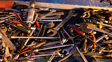 Workshop scene. Tools  and wrenches close-up on the wall board.