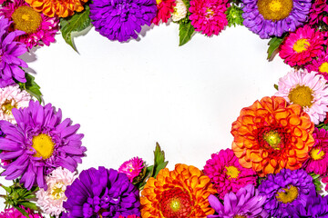 Autumn flowers flatlay background. Bouquet of colorful chrysanthemum, peonies (orange, purple,...