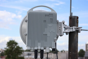 radio relay antenna on the roof with sky on background