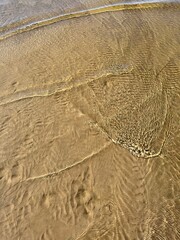 transparent sea water, sandy sea bottom 